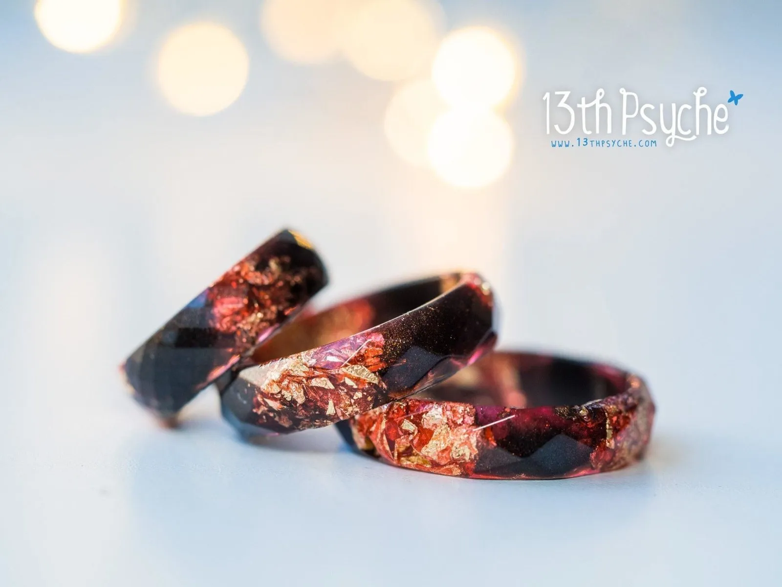 Black and red faceted resin ring with gold flakes