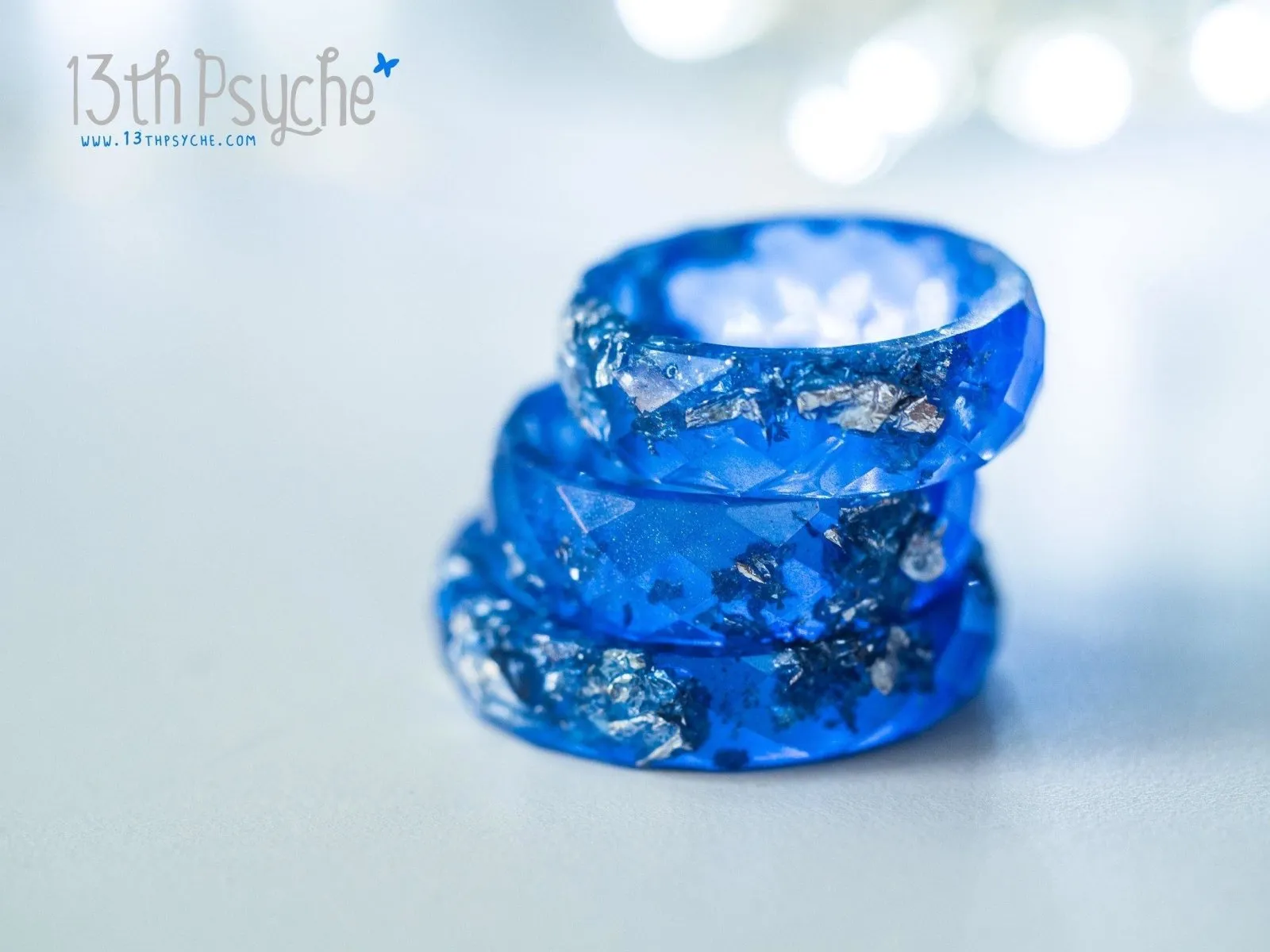 Blue and silver flakes faceted resin ring