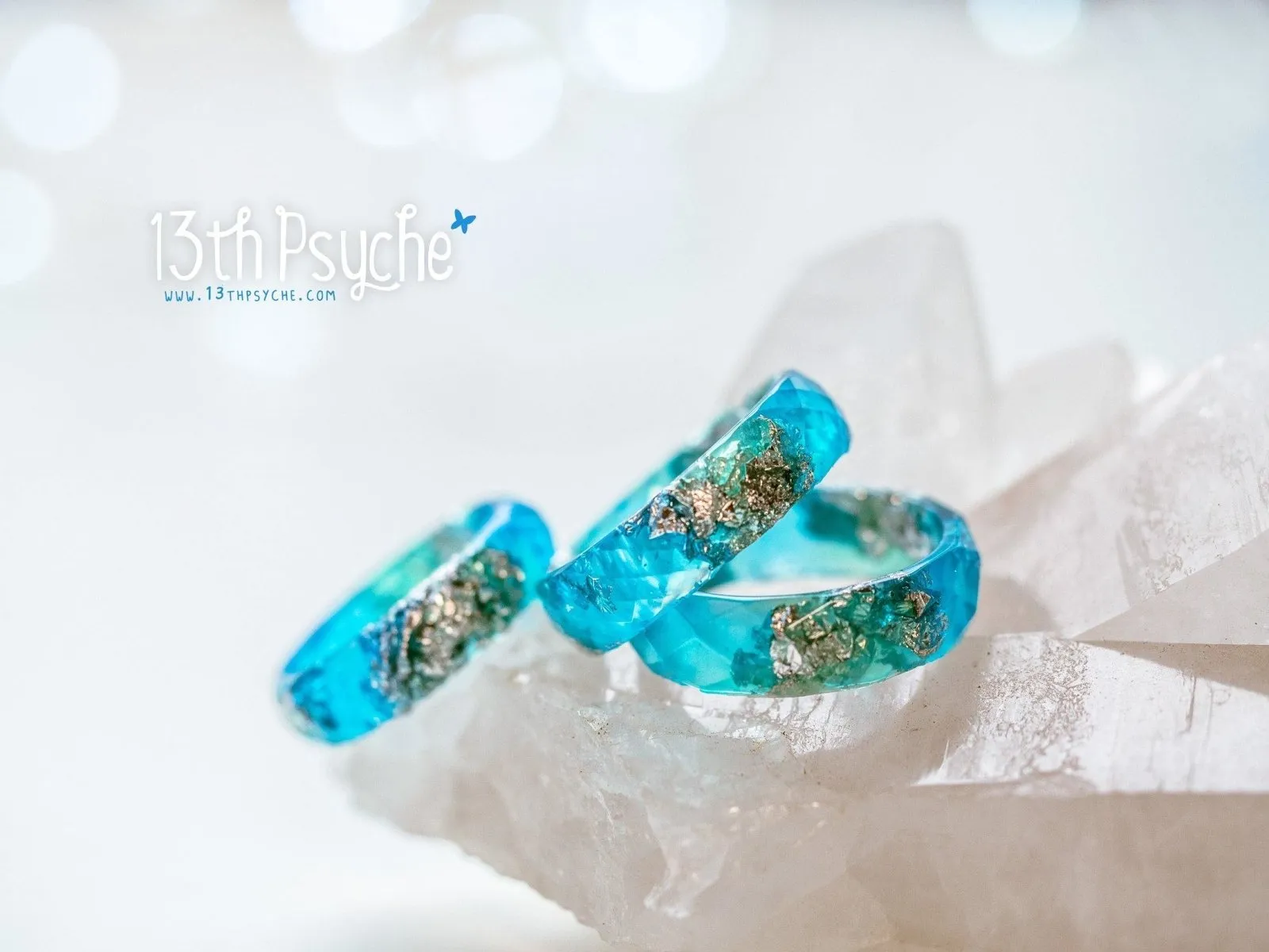 Clear blue and turquoise faceted resin ring with silver flakes