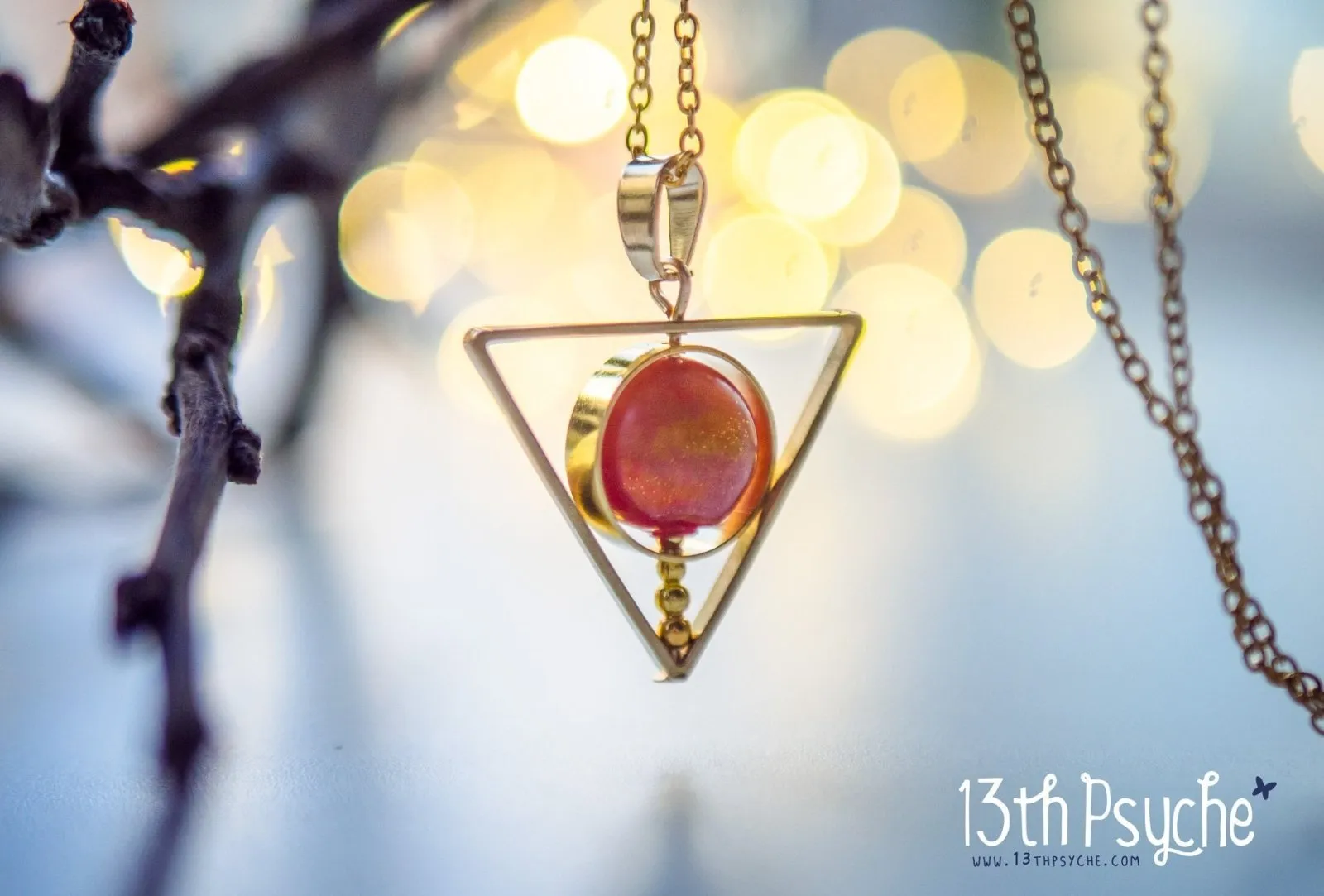 Sun star inspired triangle spinner necklace