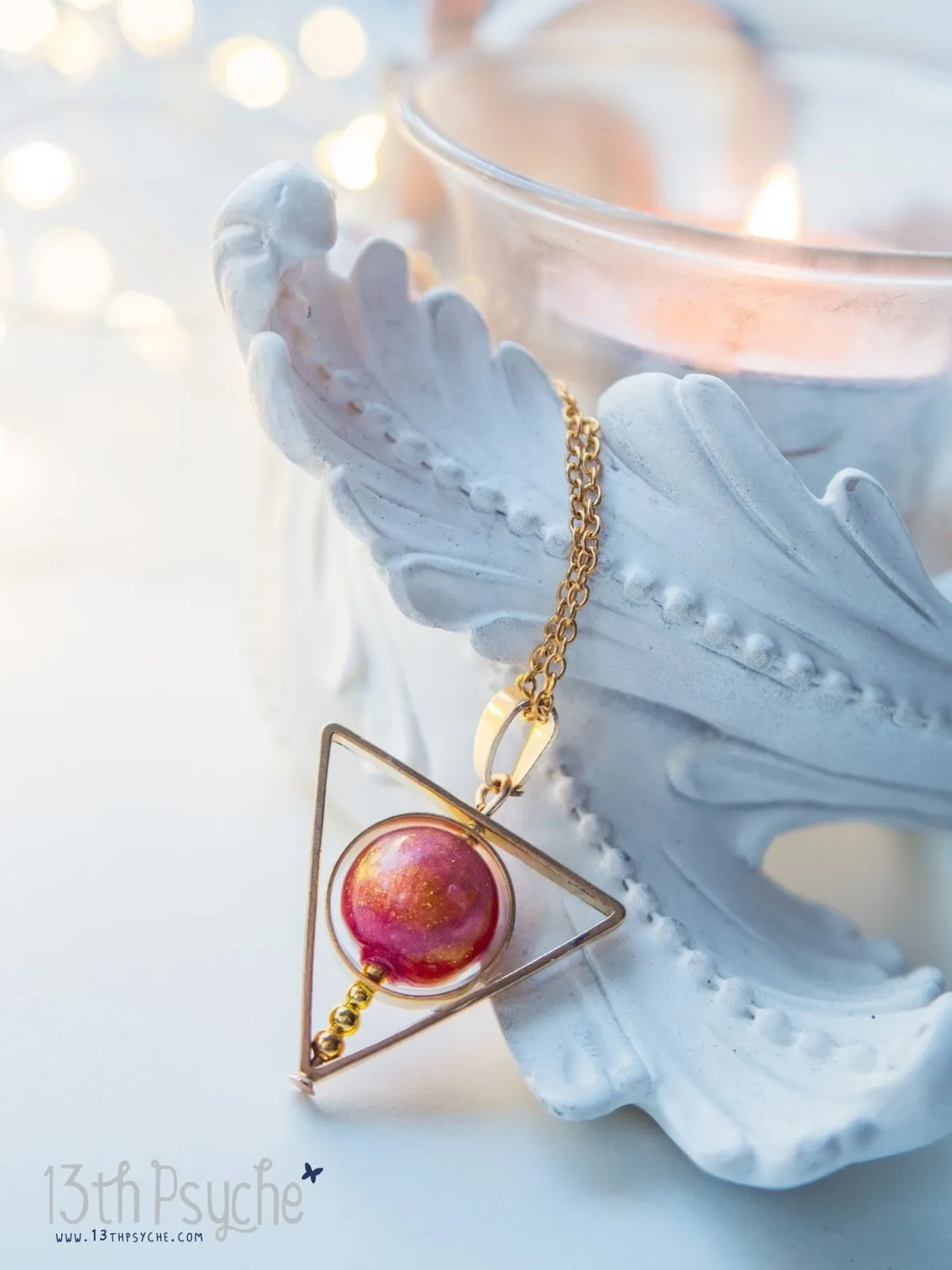 Sun star inspired triangle spinner necklace