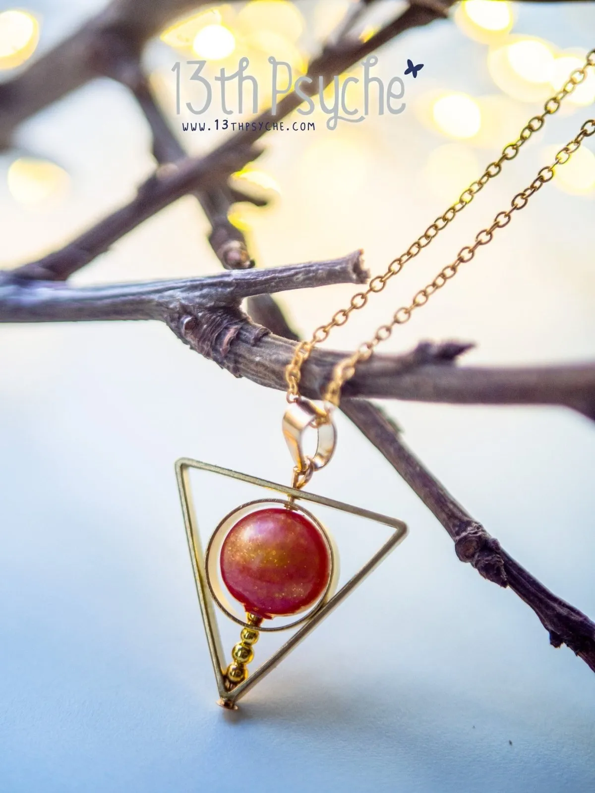 Sun star inspired triangle spinner necklace