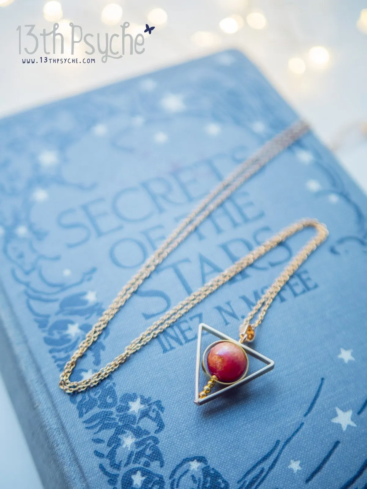 Sun star inspired triangle spinner necklace