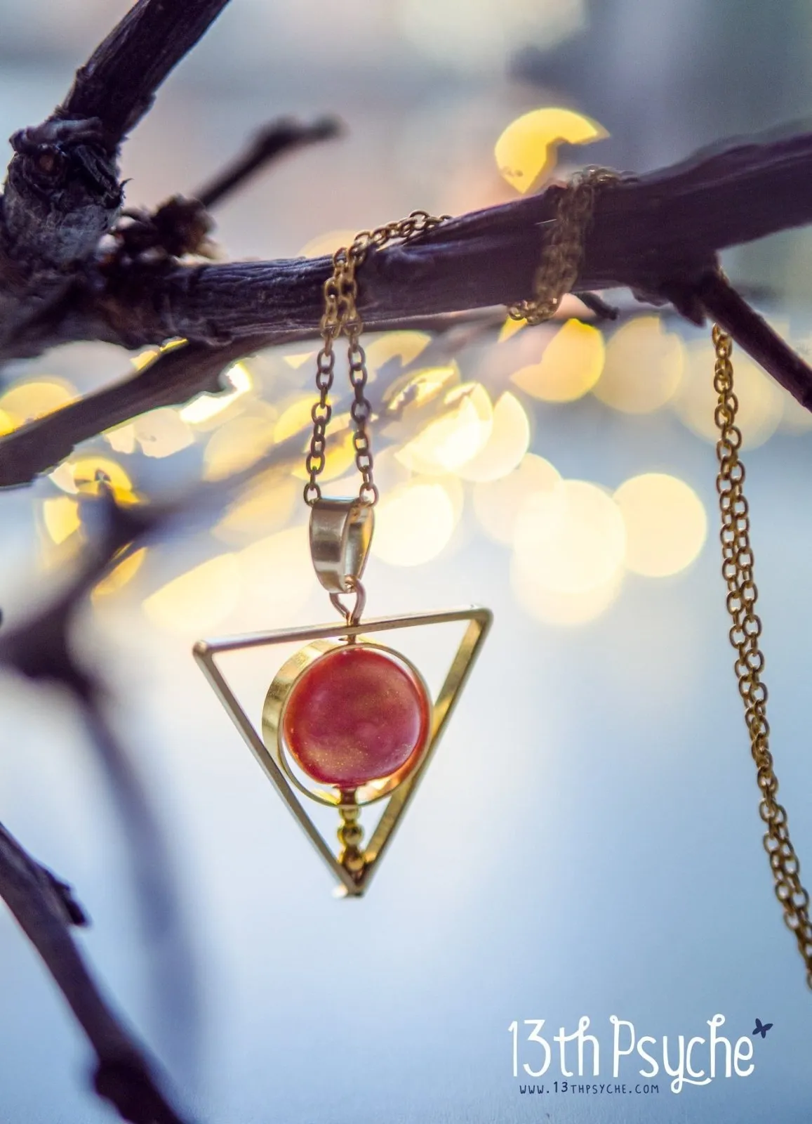 Sun star inspired triangle spinner necklace