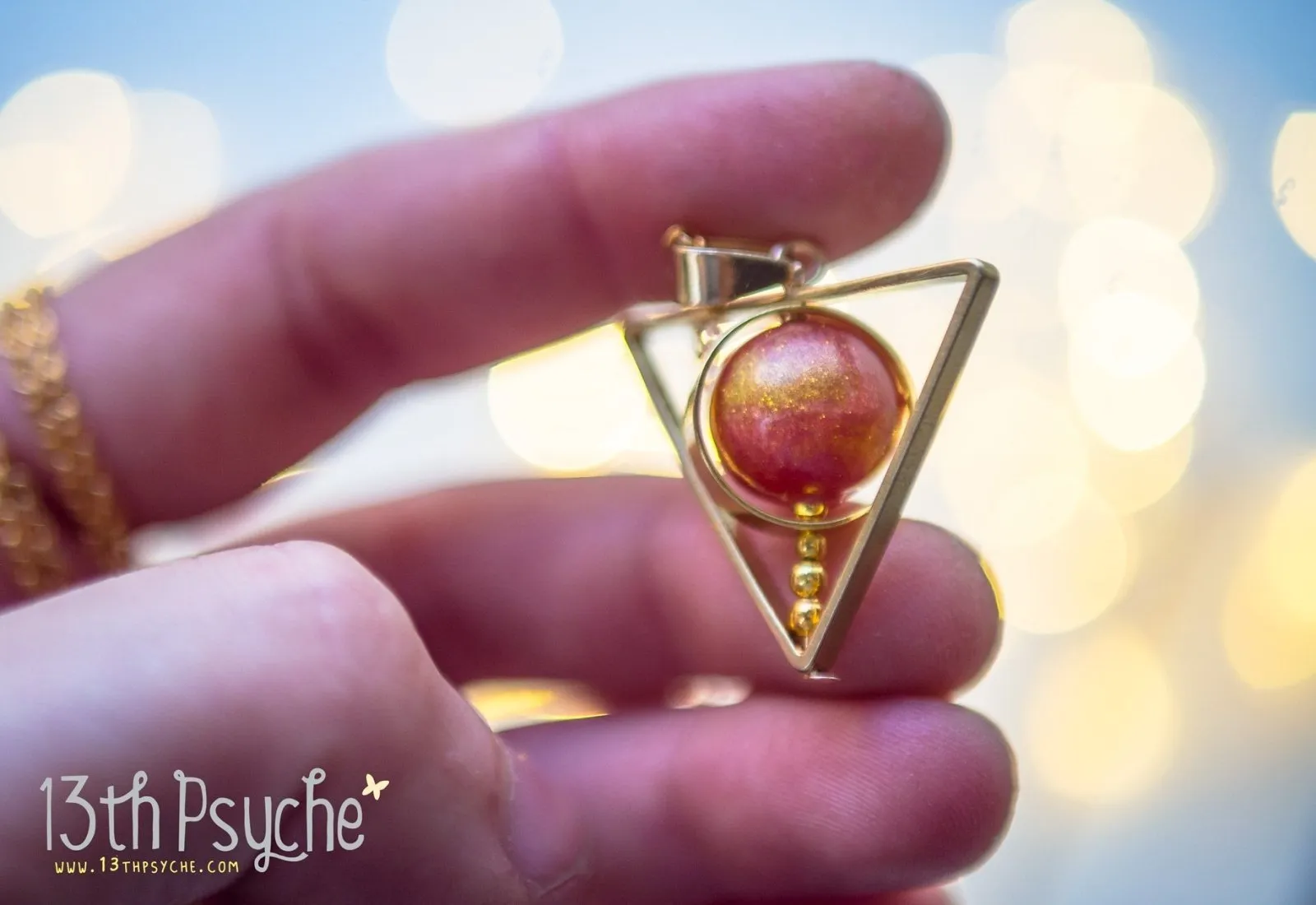 Sun star inspired triangle spinner necklace